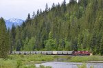 CP 8867/9810 lead an empty unit potash train E/B past the winding Eagle River, east of Taft Rd.